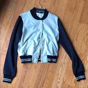 Never-worn dELia*s varsity jacket in Navy